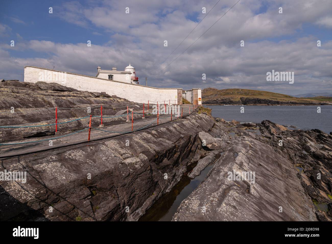 Faro dell'isola di Valencia sulla costa atlantica della contea di Kerry, Irlanda Foto Stock