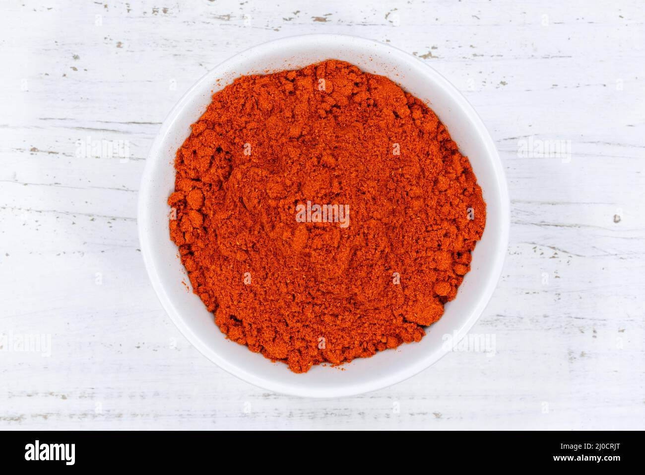 Paprika polvere paprika polvere calda da sopra tavola di legno Foto Stock