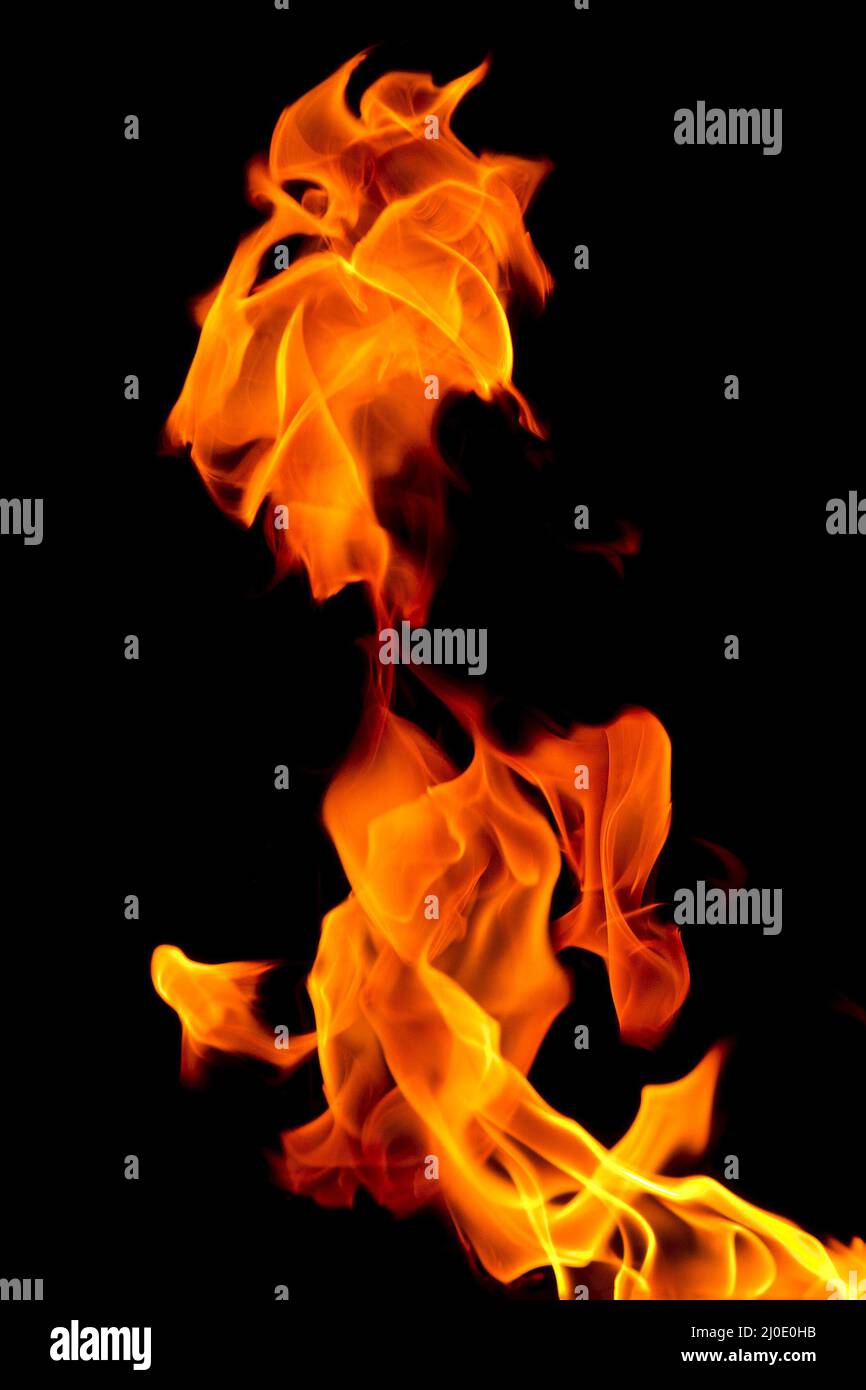 Fiamma ardente isolato su nero Foto Stock