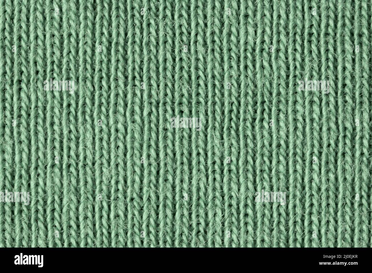 Fibre di cotone verde sbiadite in primo piano Foto Stock