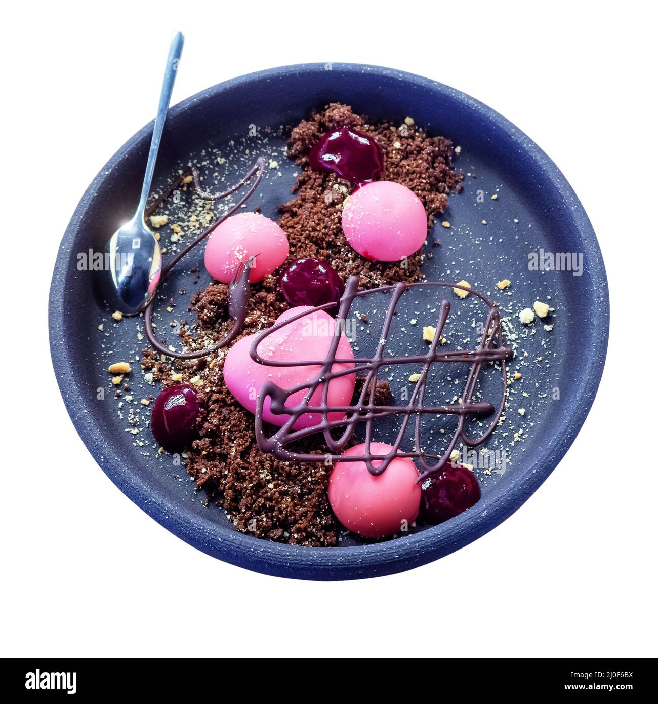 Dessert a forma di cuore e palline rotonde in glassa rosa con marmellata di lamponi e figura di cioccolato in un biscotto sbriciolato su un Foto Stock