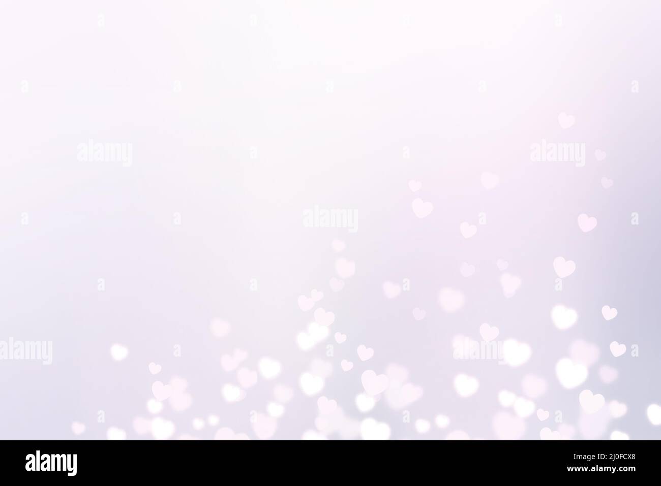 Cuori bianchi luminosi con effetto bokeh Foto Stock
