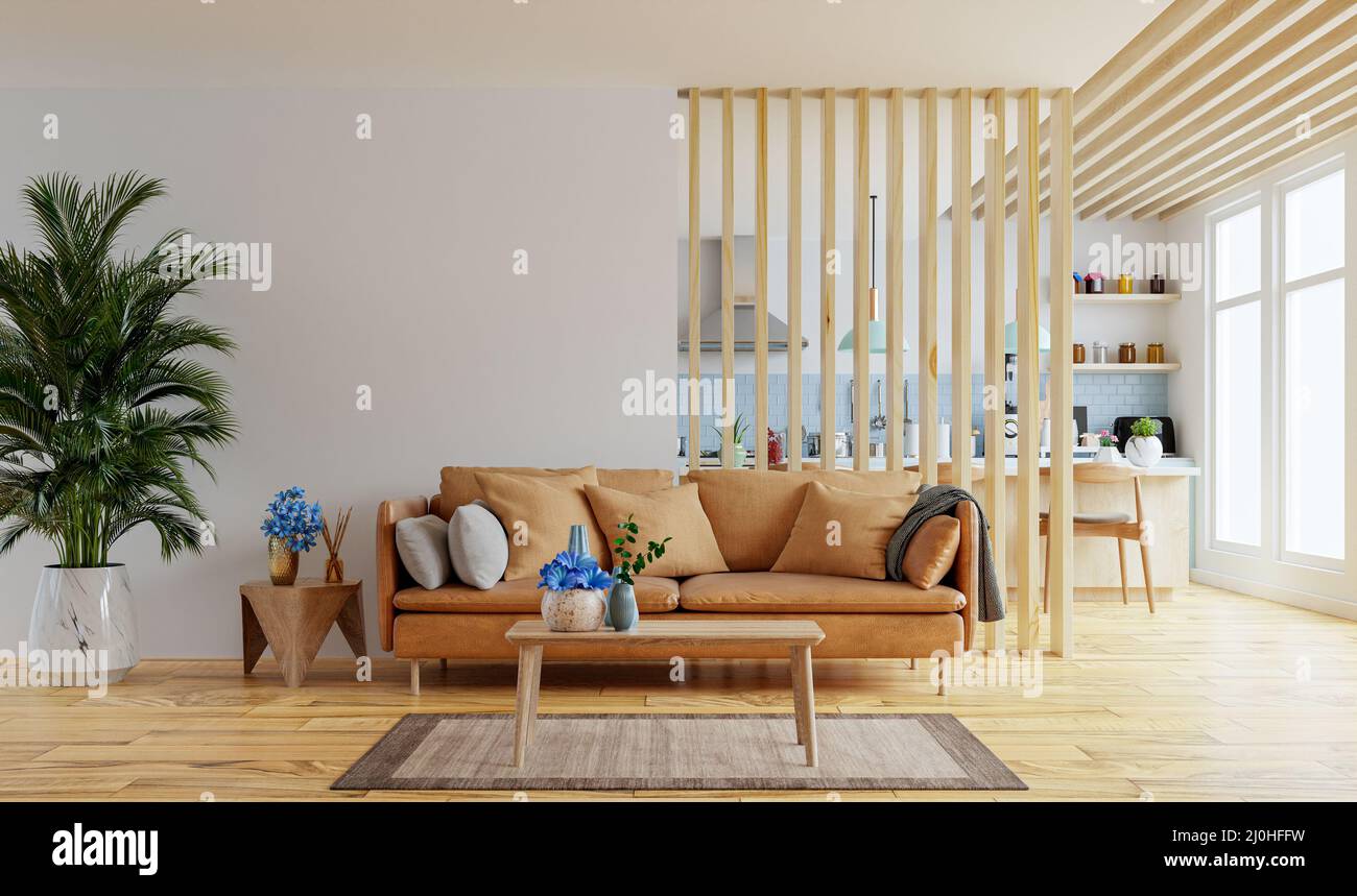 Mockup delle pareti interne del soggiorno in tonalità calde con divano in pelle che si trova dietro la cucina.rendering 3d Foto Stock