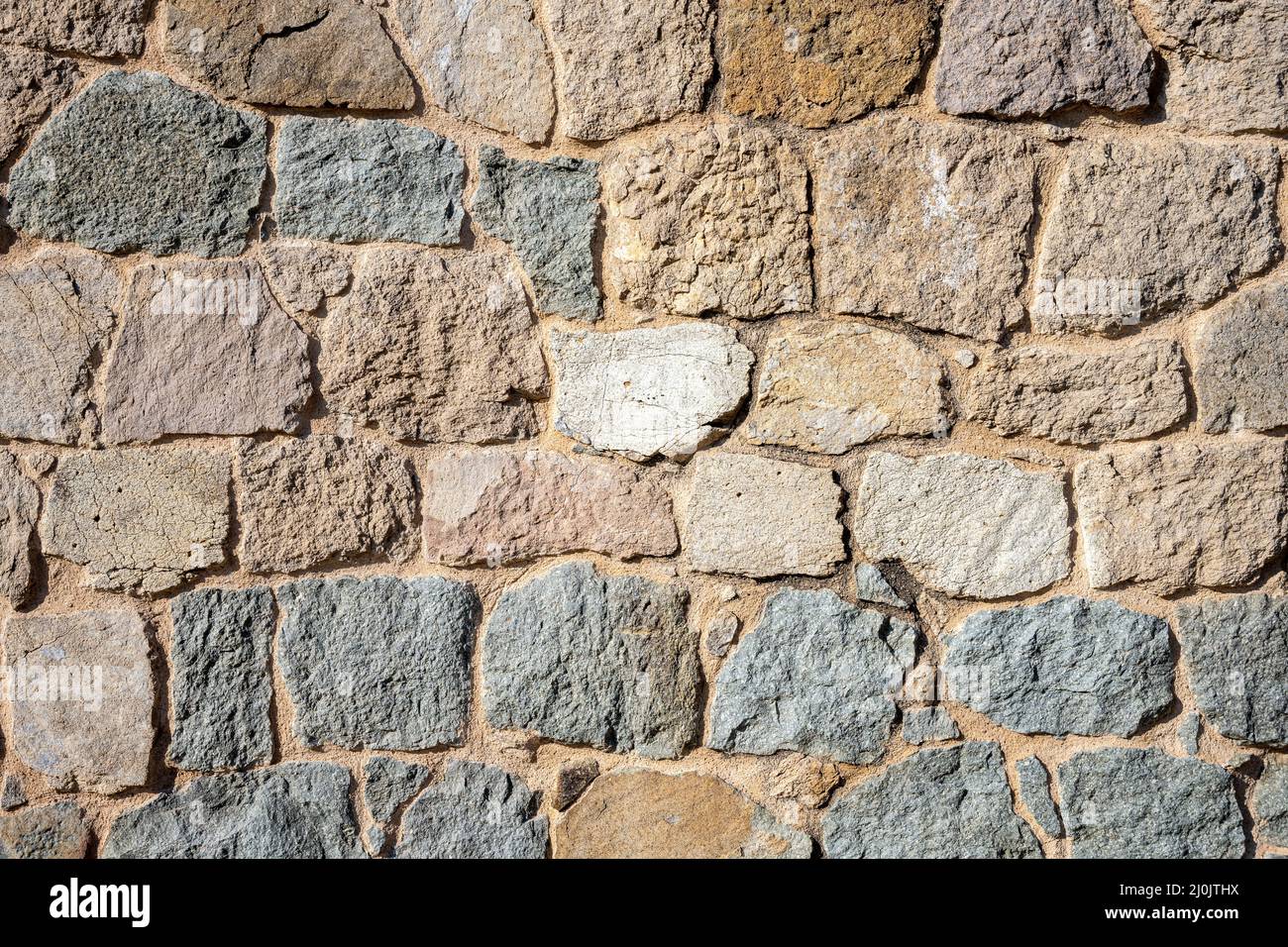 Sfondo da un muro di pietra naturale Foto Stock