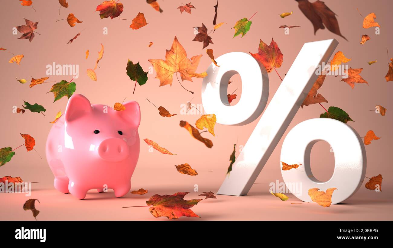 Piggy banca con percentuale bianca in foglie d'autunno Foto Stock