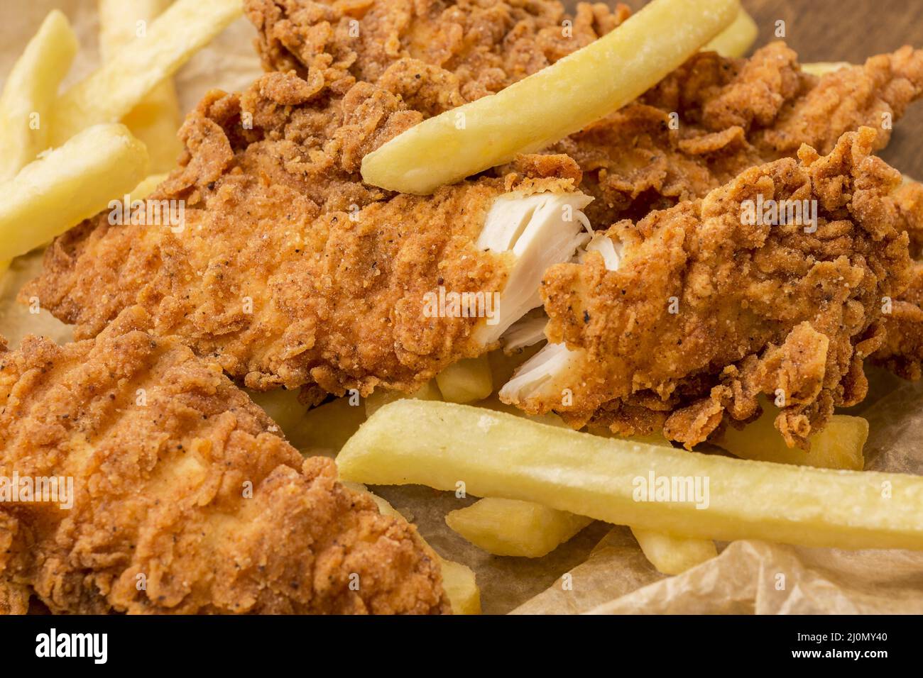 Primo piano patatine fritte di pollo Foto Stock