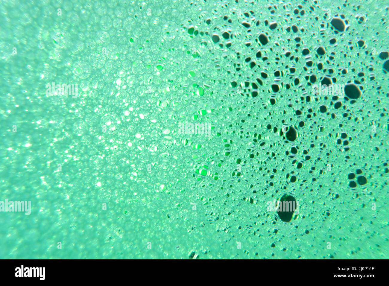 foto macro di schiuma di sapone colorata Foto Stock