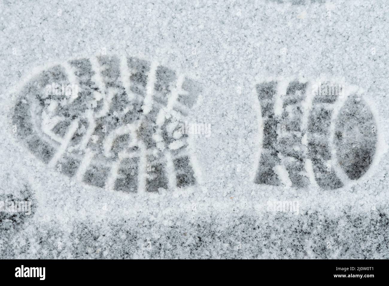 Impronte nella neve di una suola di scarpe - stampa di scarpe Foto Stock