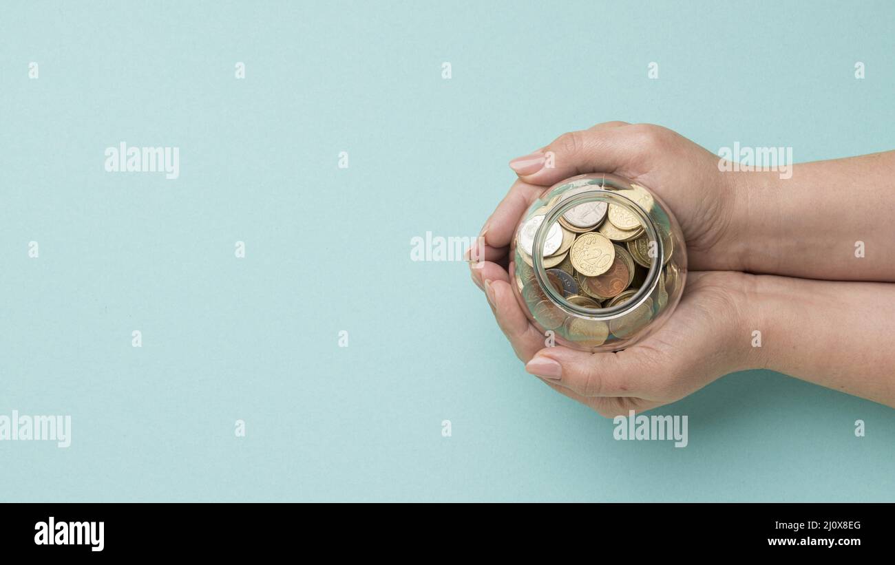 Vasetto in vetro Coins con spazio per la copia. Concetto di foto di alta qualità Foto Stock