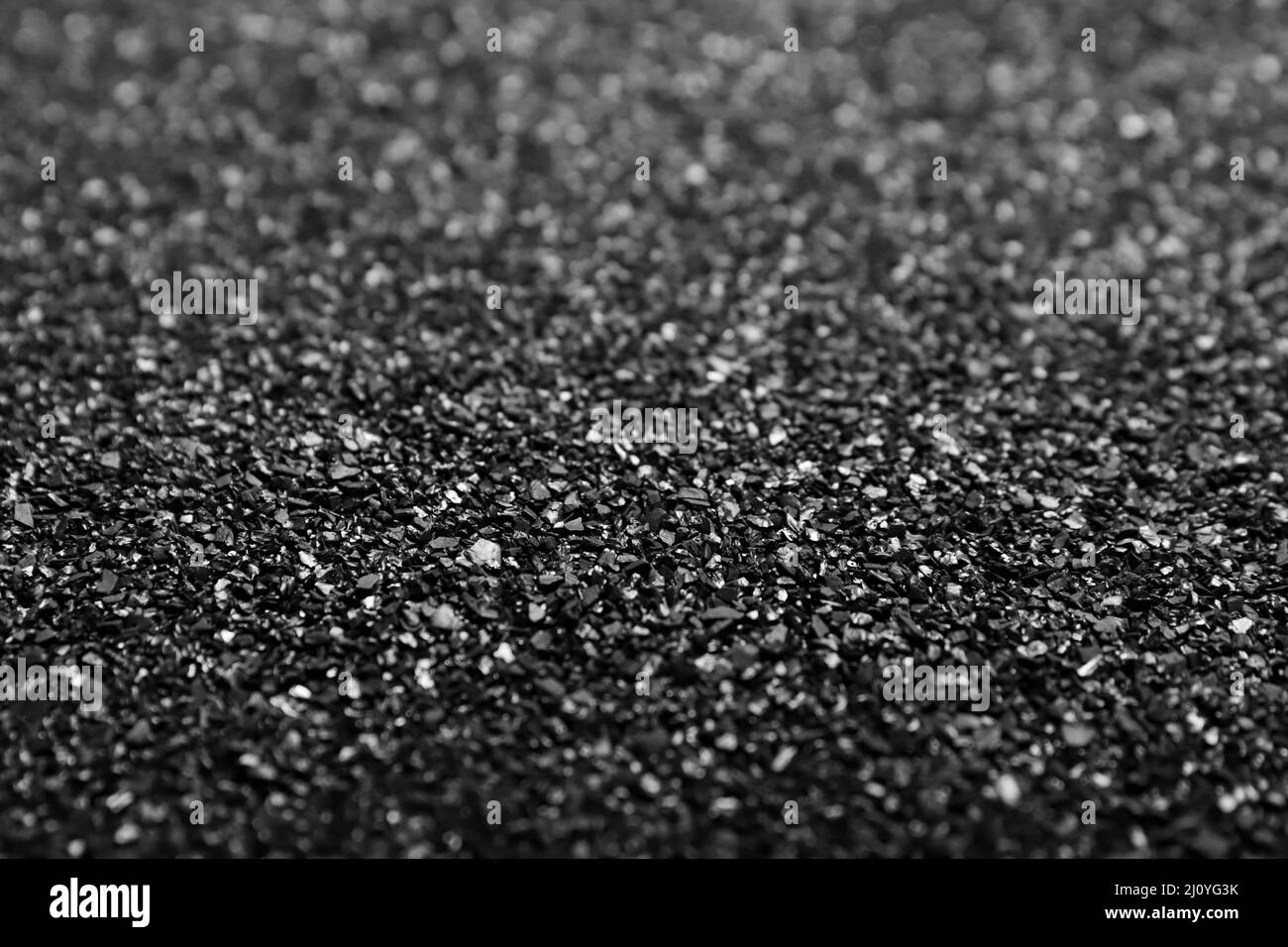 Carbone attivo al cocco come sfondo Foto Stock