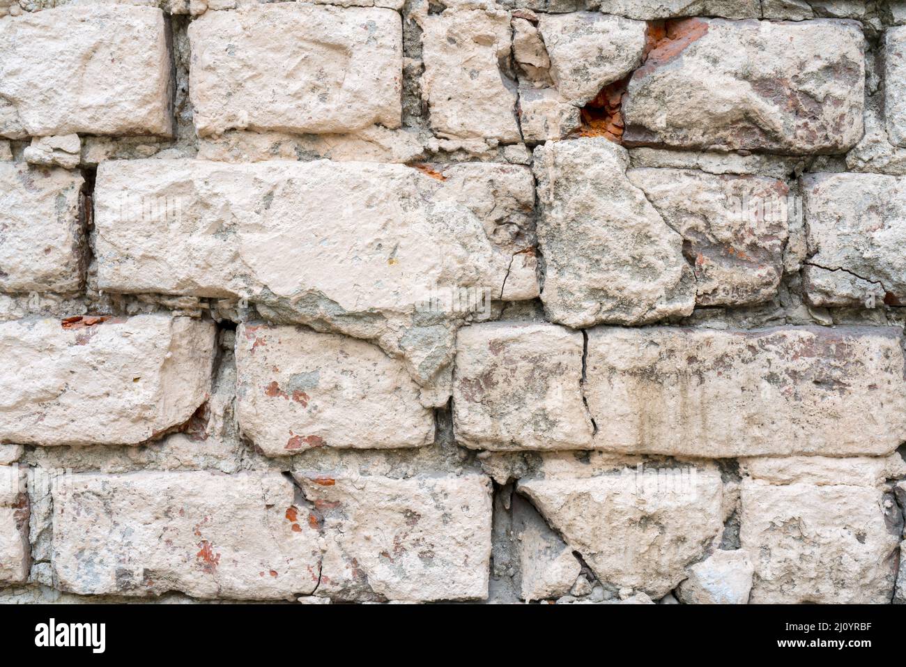 Bianco e beige di vernice sul muro di una casa. Costruzione e riparazione. Foto Stock