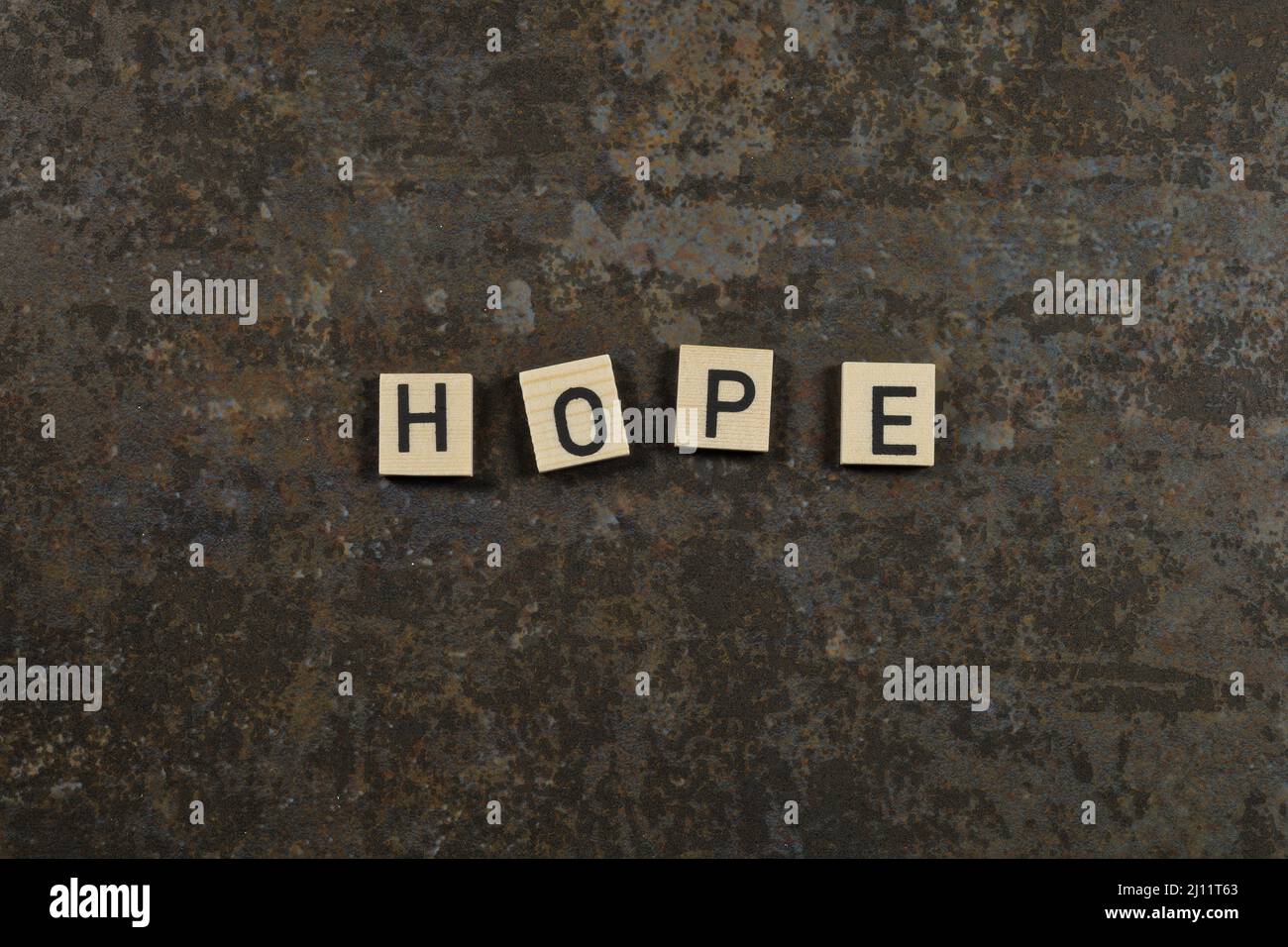 frase 'hope' su sfondo di ceramica marrone Foto Stock