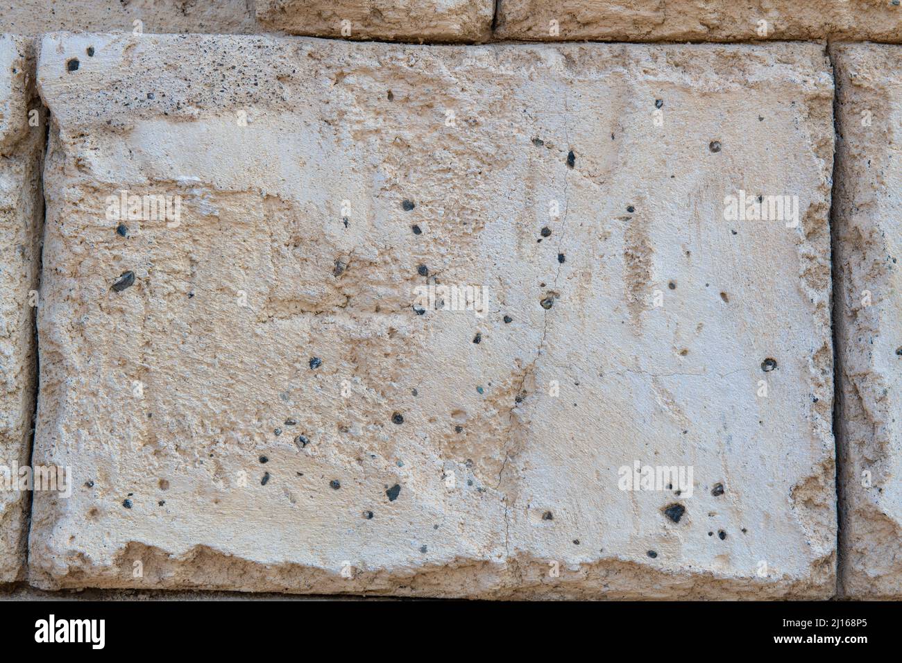 trama di un muro di pietra grigia Foto Stock
