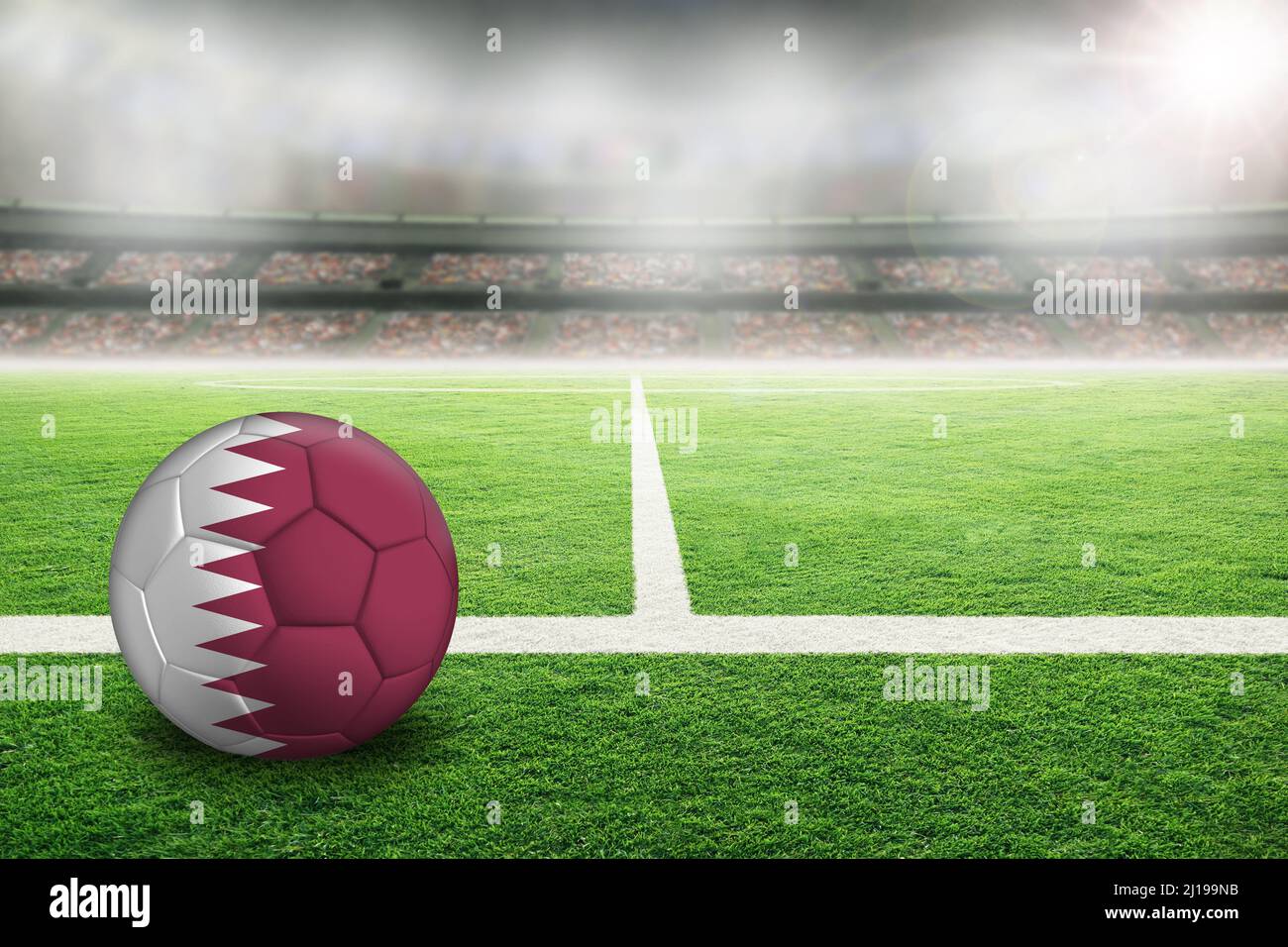 Calcio in uno stadio all'aperto luminoso con bandiera Qatar dipinta. Focus su primo piano e palla di calcio con profondità di campo poco profonda sullo sfondo e co Foto Stock