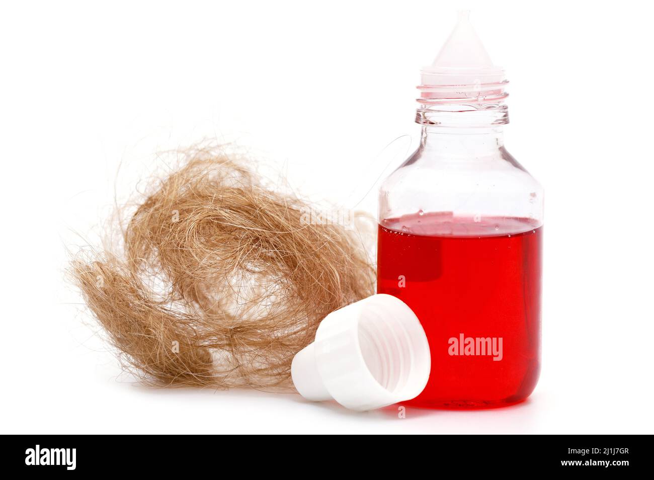 Bottiglia con olio speciale per prevenire la perdita dei capelli Foto Stock