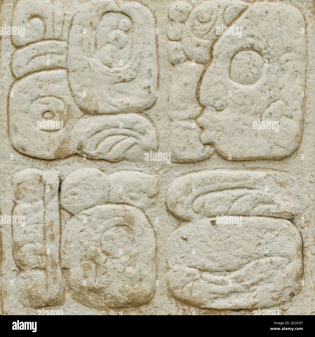 Antico copione Maya scolpito sul muro di pietra Foto Stock