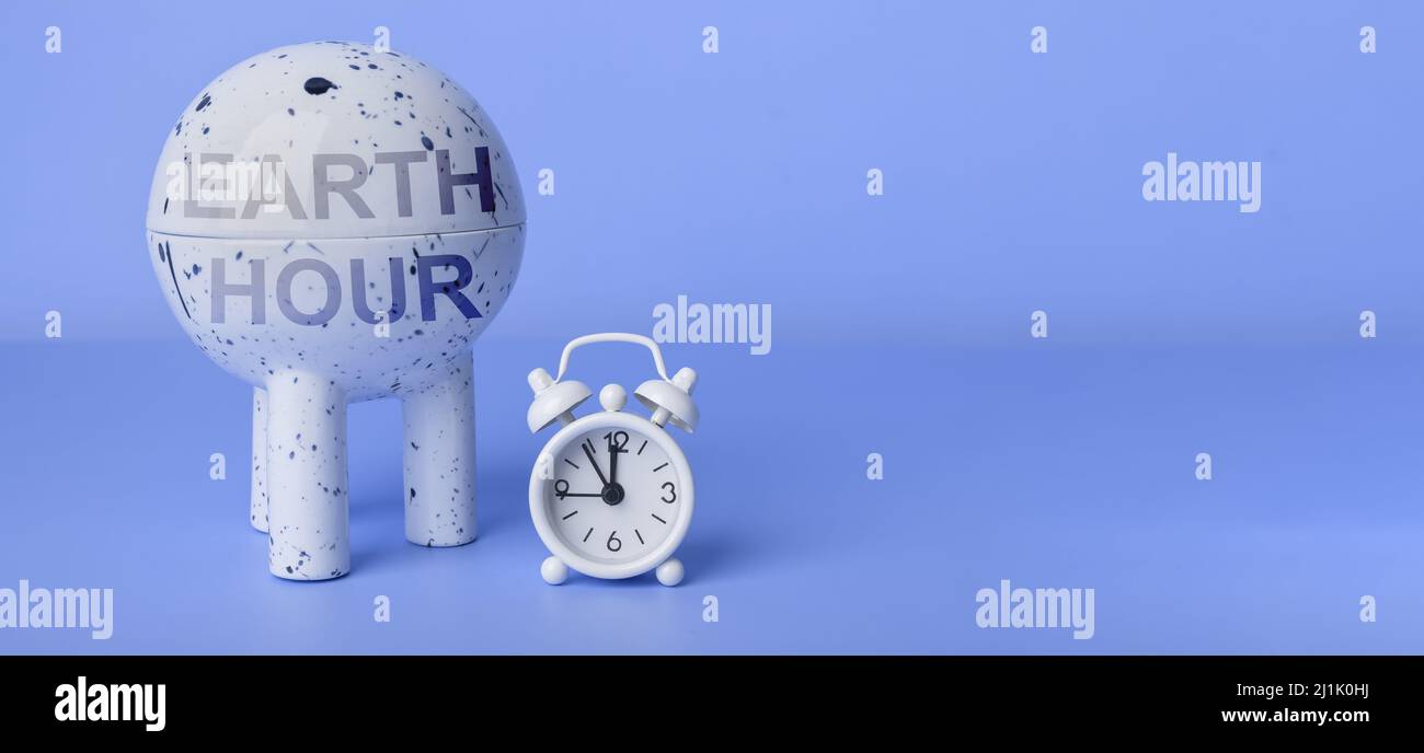 Giorno dell'ora di terra. Tempo di prendersi cura dell'ambiente, dell'ecologia. Banner blu con spazio per la copia. Foto Stock