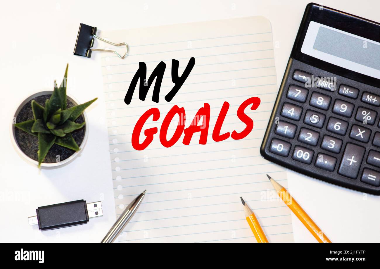 Parola incantesimo SMART Goals e scrittura a mano i miei obiettivi in notebook con penna Foto Stock