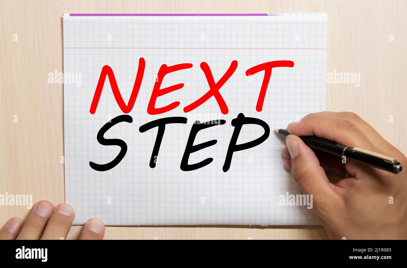 Testo del passo successivo scritto su un diario Foto Stock