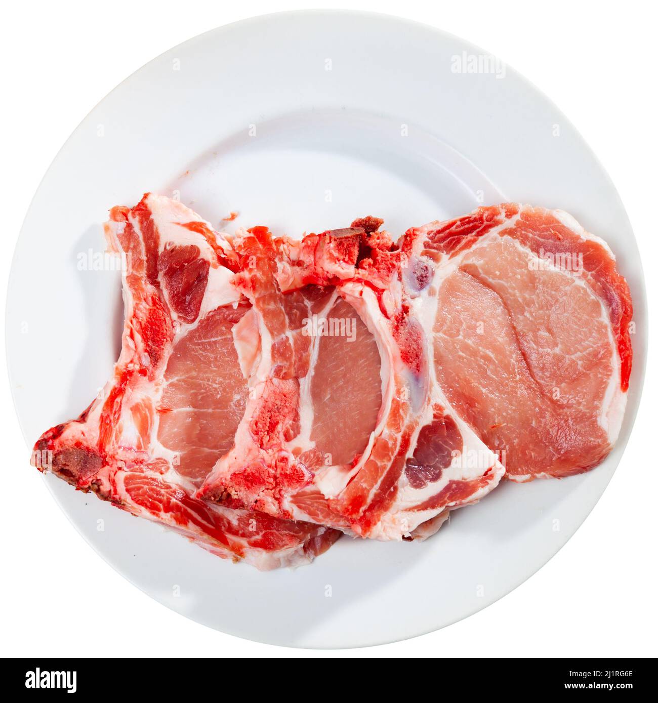 Pezzi di bistecche di lombo di maiale crudo Foto Stock