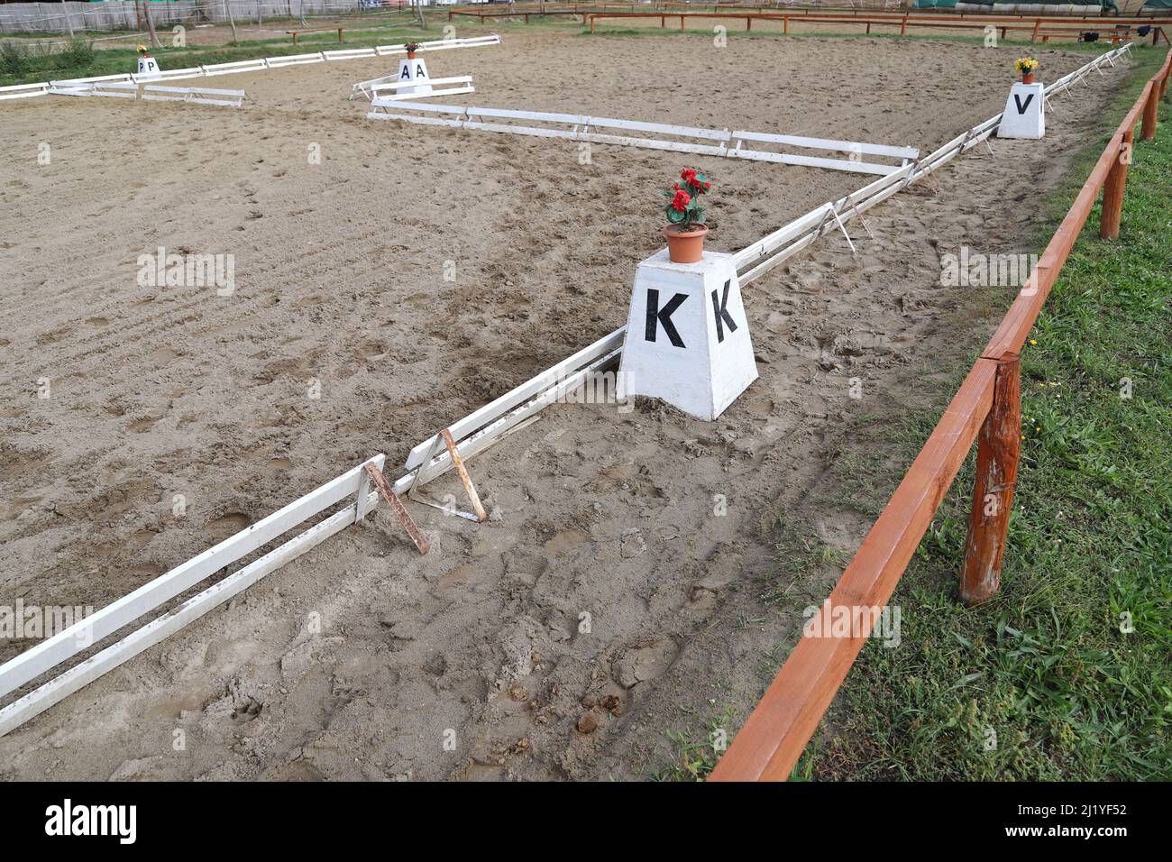 Lettere riferimenti dell'arena sportiva su pista di dressage. Sport equestre competizione concept background Foto Stock