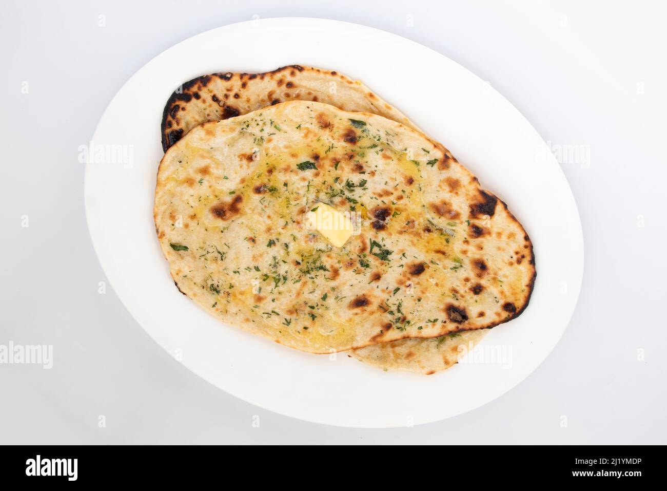 Pane indiano Tandoori Naan chiamato anche Amritsari Tanduri Nan Kulcha pane cotto nel forno caldo Tandoor è popolare Flatbread goduto nel Nord e Sud i Foto Stock