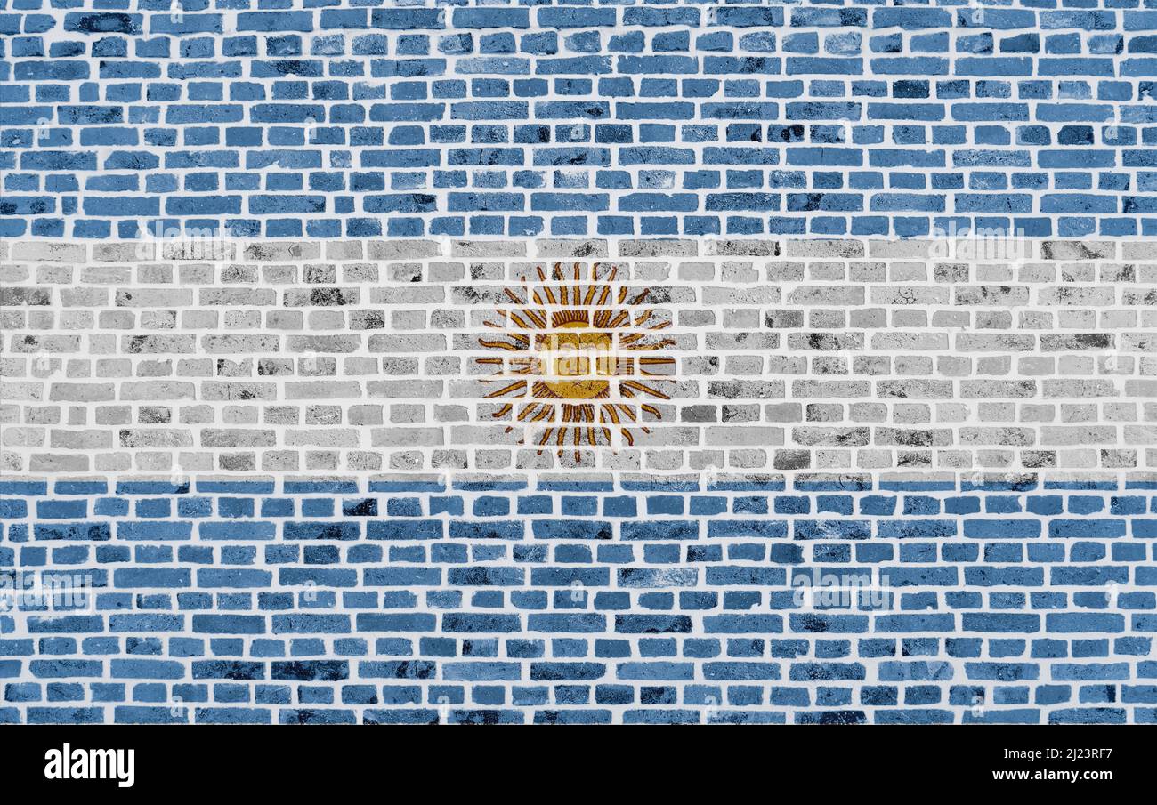 Primo piano su un muro di mattoni con la bandiera dell'Argentina dipinta su di esso. Foto Stock