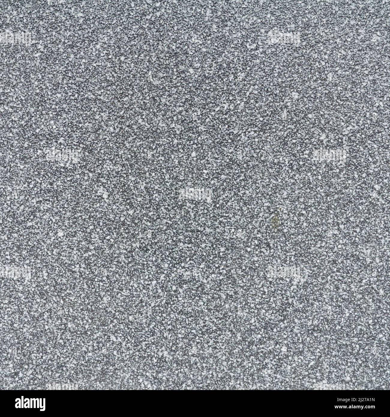 Superficie in granito grigio. Grana grigia-bianca. Sfondo grigio marrone chiaro. Sfondo o sfondo astratto testurizzato. Foto Stock