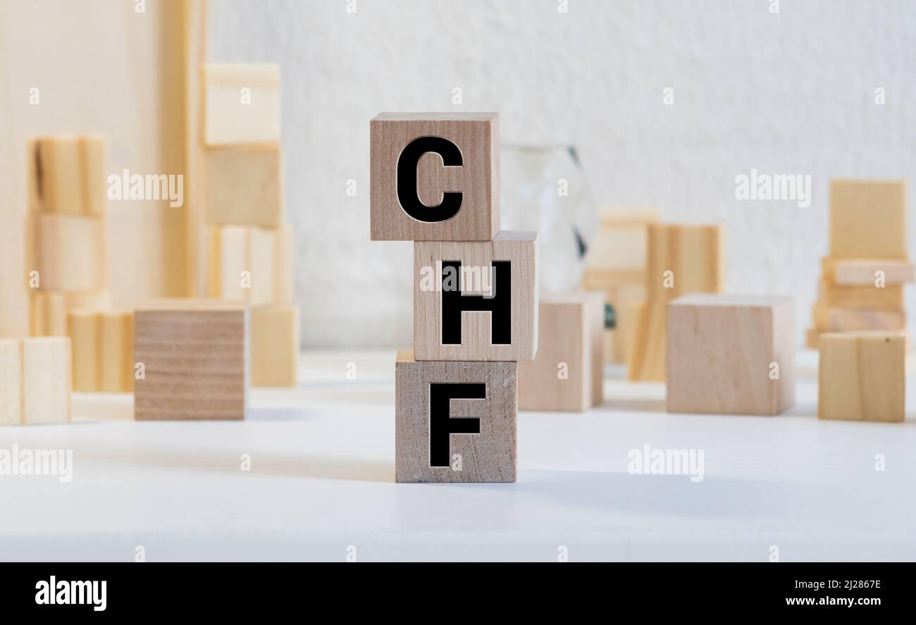 CHF Franco Svizzero blocco di testo su tavola in legno Foto Stock
