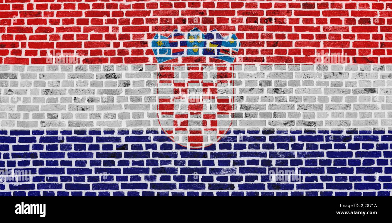 Primo piano su un muro di mattoni con la bandiera della Croazia dipinta su di esso. Foto Stock