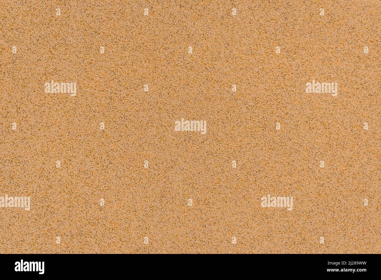 Finitura dell'edificio materiale dell'edificio Crumb Ghiaia dettagliata grana grana grossa superficie sabbia marrone ruvida sfondo. Foto Stock