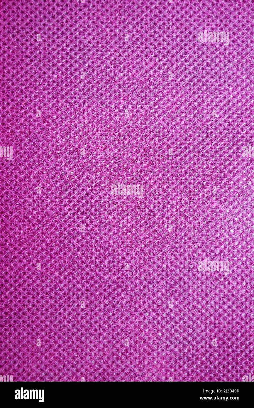 materiale colore fucsia rosa scuro per sfondo verticale tessile. Foto Stock