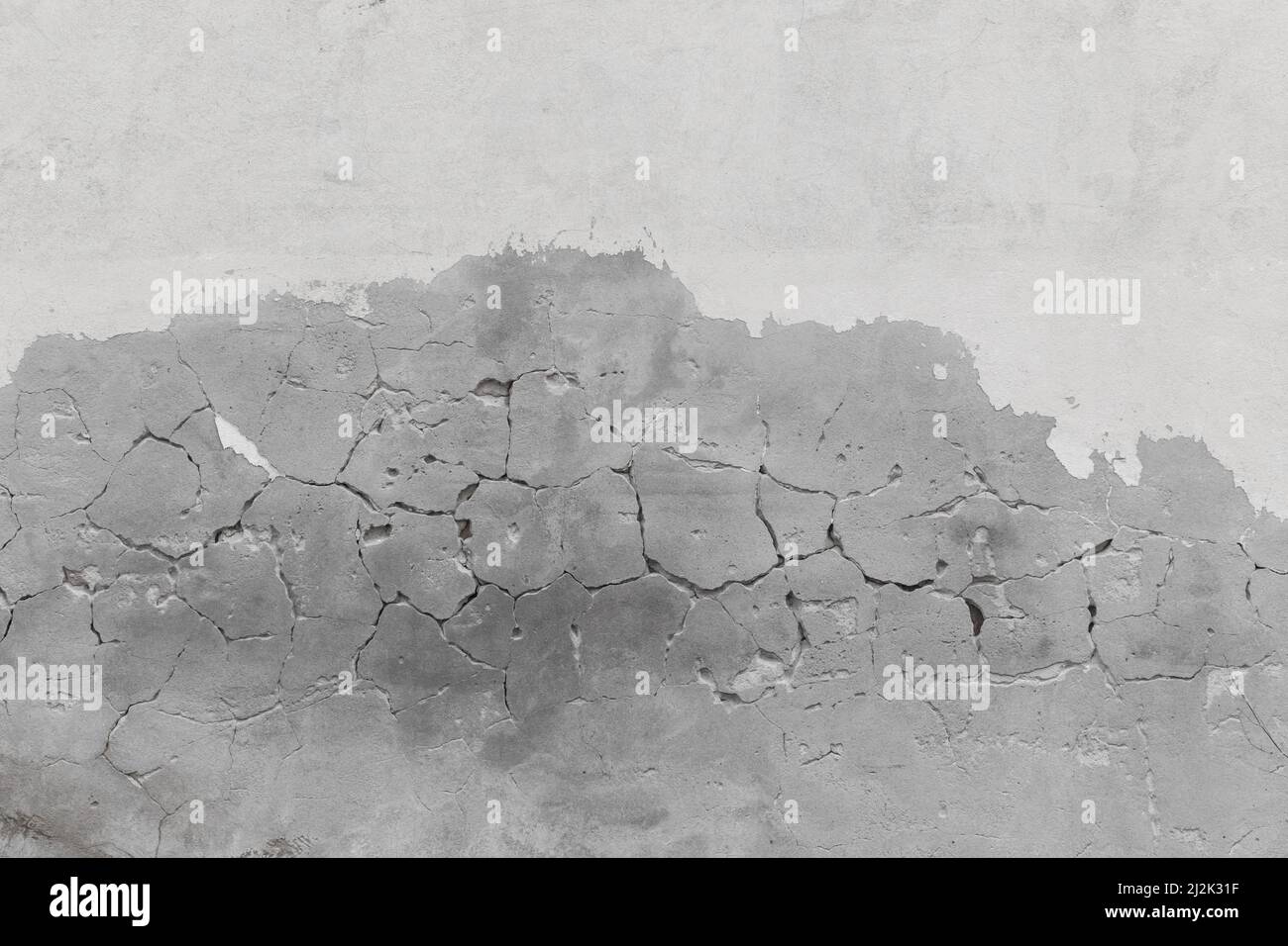 Grigio calcestruzzo vecchio cemento fessurato superficie trama Crack Grigio sfondo. Foto Stock
