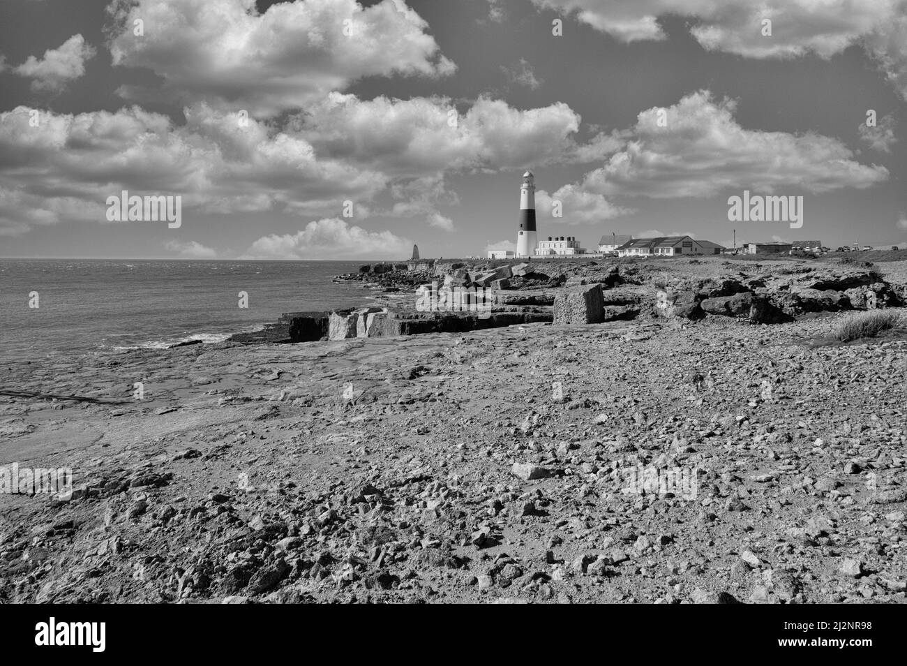 Il faro di Portland Bill è alto 43meters e si trova sull'isola di Portland vicino alla località costiera di Weymouth nel Dorset occidentale è stato illuminato per la prima volta nel 1906 Foto Stock