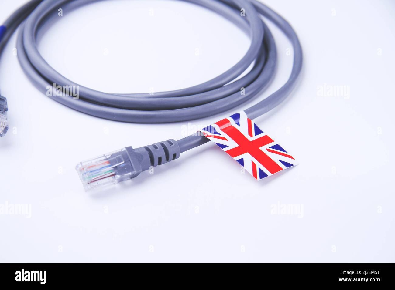 Cavo Internet con bandiera britannica. Connessione di un PC a Internet in Gran Bretagna. Foto Stock