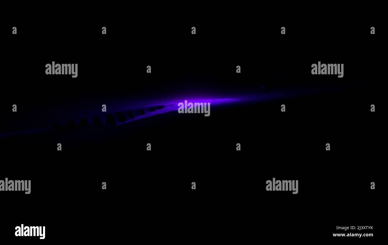 Background.Design. Uno sfondo nero e una cometa viola che cade sullo sfondo. Foto Stock