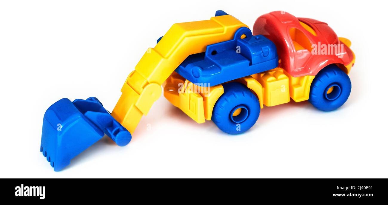 escavatore colorato in plastica giocattolo, isolato Foto Stock