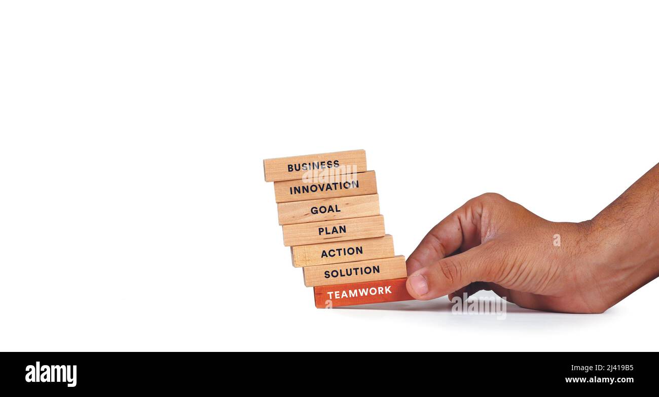Business mano arrangiamento legno blocco con parola SQUADRA DI LAVORO concetto. Foto Stock