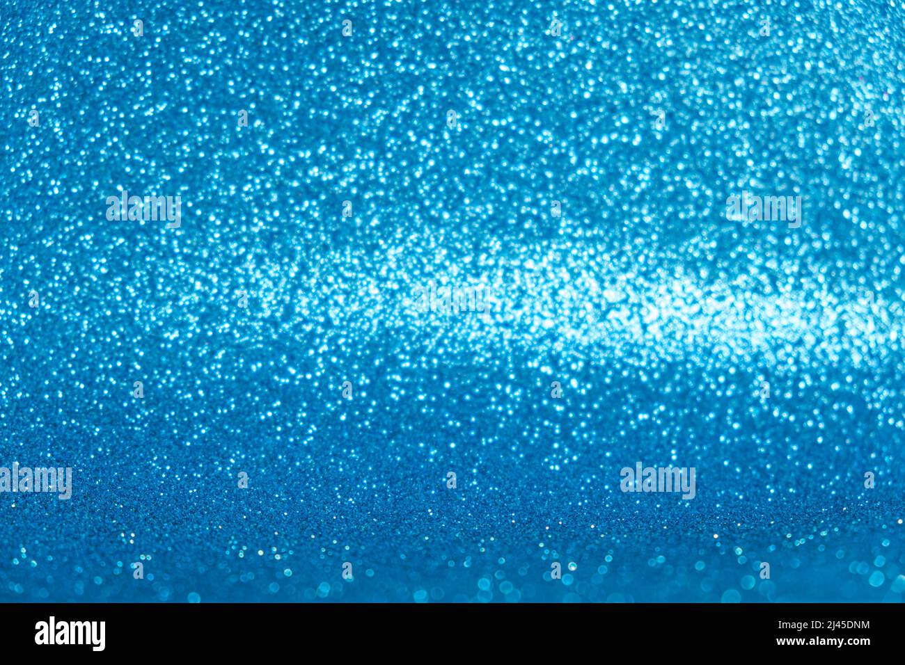 Sfondo blu astratto con luci scintillanti e bokeh. Foto Stock