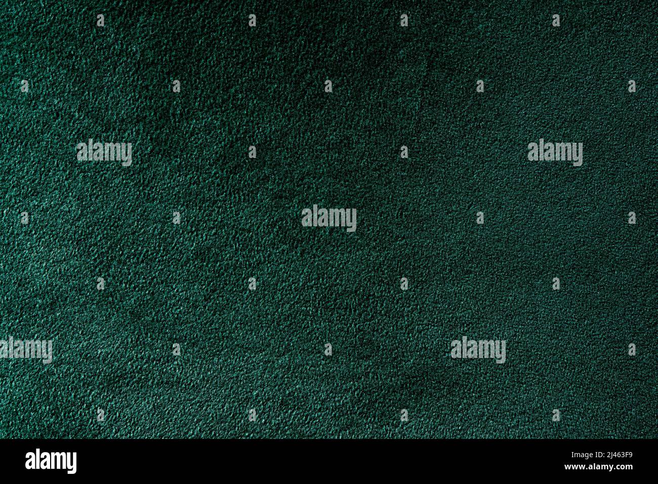 primo piano di un'elegante vellutata verde scuro, da utilizzare come sfondo Foto Stock