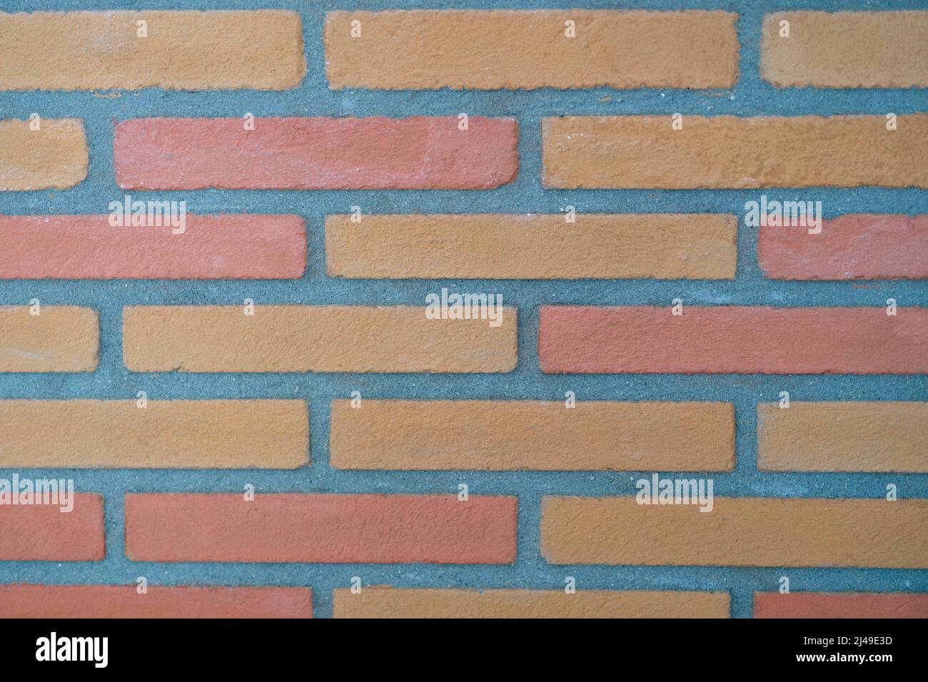 Muro di pietra fatto di mattoni rettangolari primo piano Foto stock - Alamy