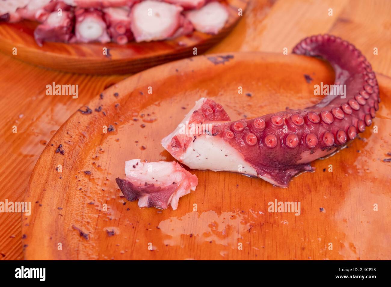 Tentacoli di polpo cucinati in Galizia in stile Pulpo a Feira Foto Stock