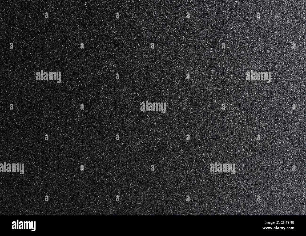 Vista ravvicinata macro superficie opaca in metallo nero testurizzato Foto Stock