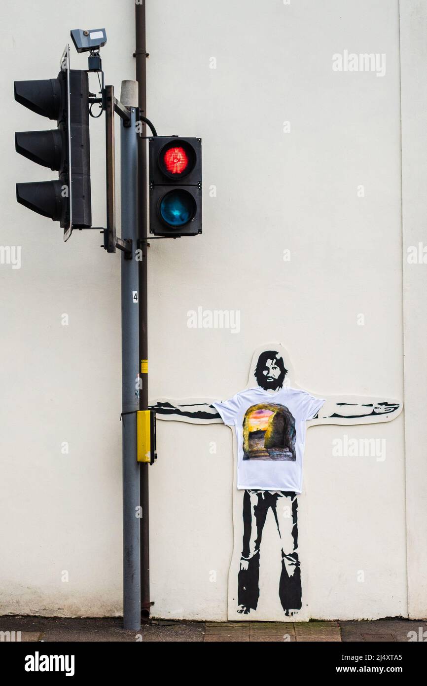 Gesù Cristo che spinge un traffico segnali graffiti Foto Stock