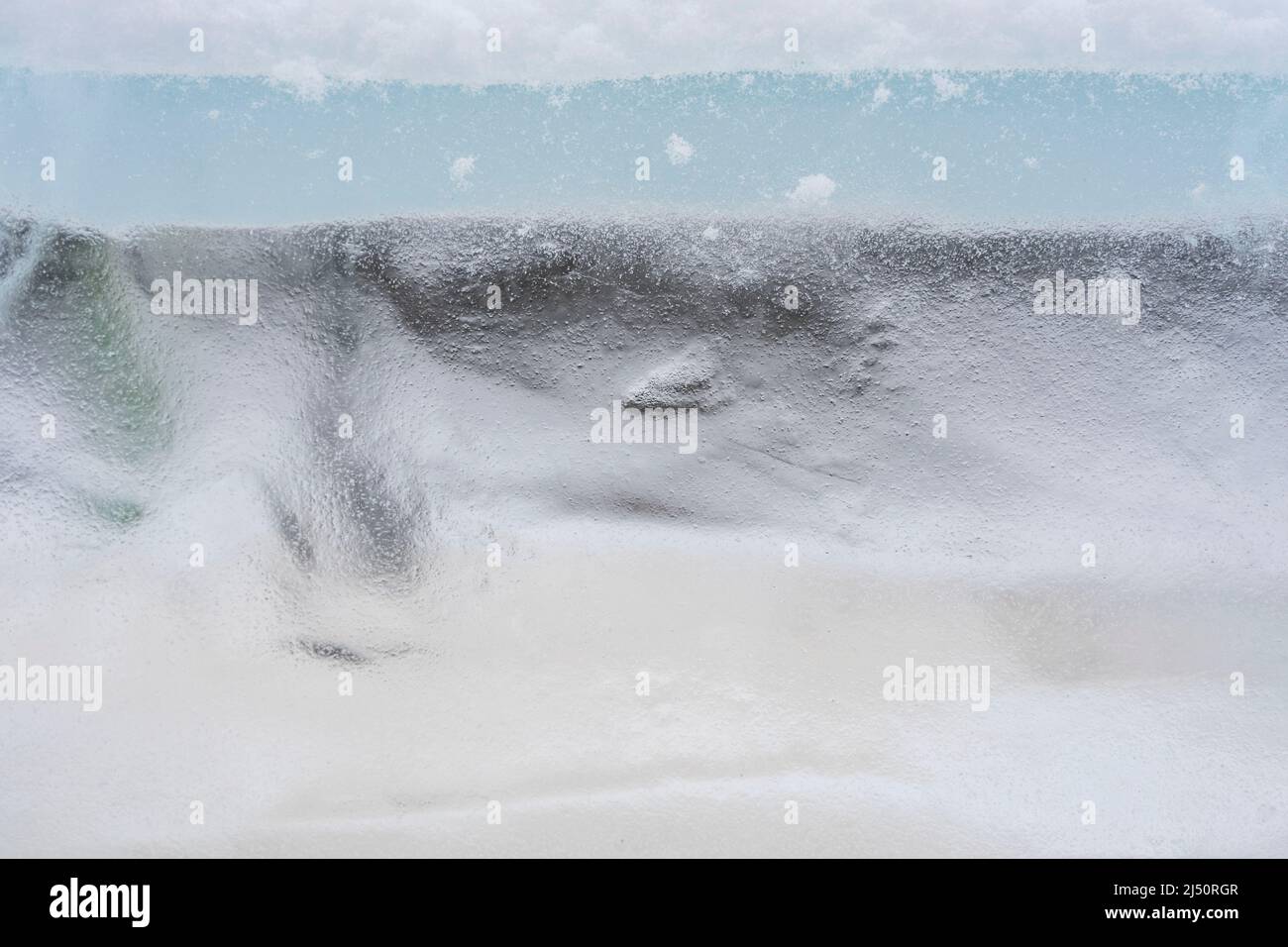 fondo di ghiaccio, tessuto congelato blu Foto Stock