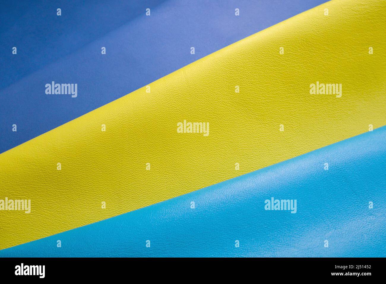 Primo piano di morbida nappa blu, gialla e blu chiaro. Foto Stock