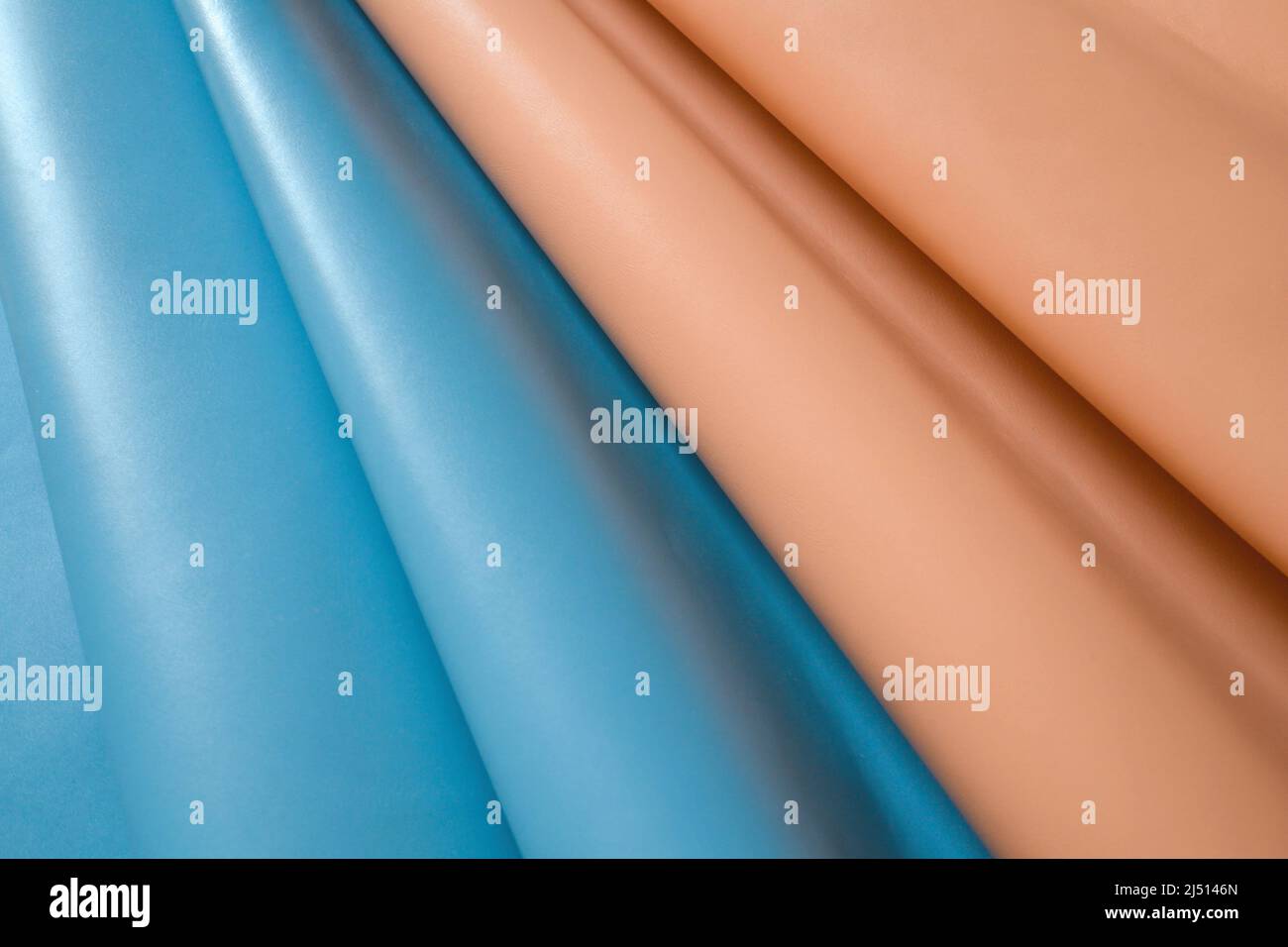 Primo piano di morbida nappa blu e arancione chiaro. Foto Stock
