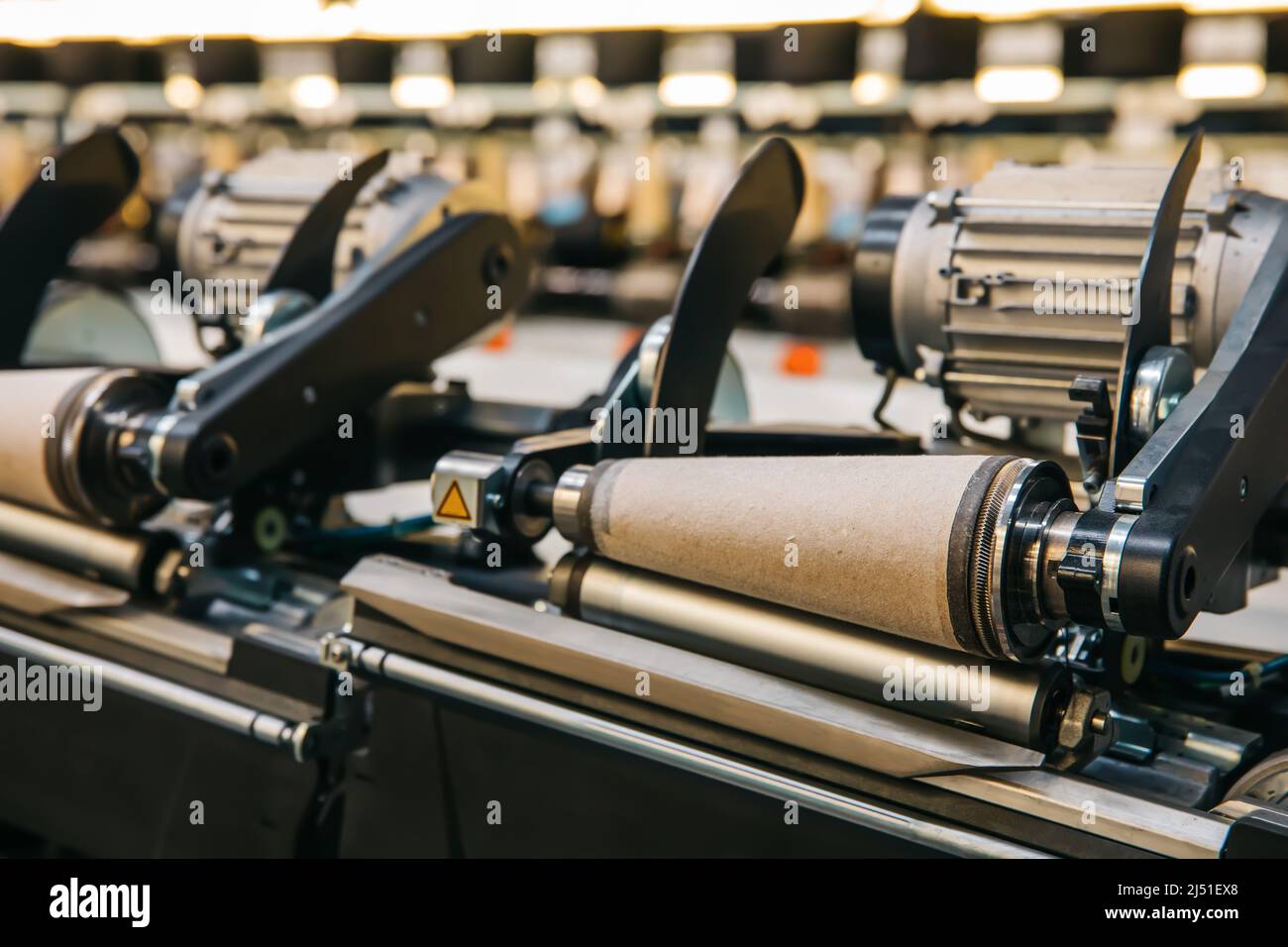 Parti di macchine per filatura presso la fabbrica di filati di cotone. Foto Stock