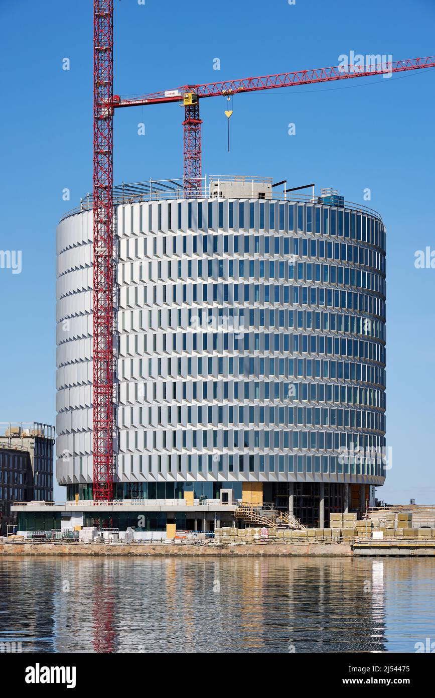 Costruzione dell'edificio circolare degli uffici 'Spidsen' a Nordø/Redmolen, Copenaghen, Danimarca Foto Stock