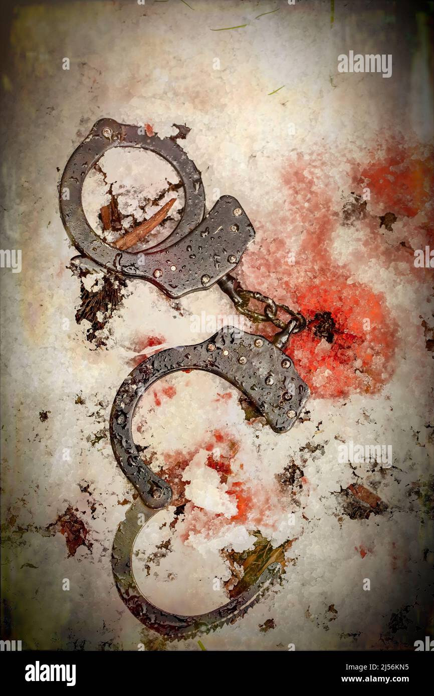 Manette e macchie di sangue nella neve, un concetto di copertina libro Foto Stock